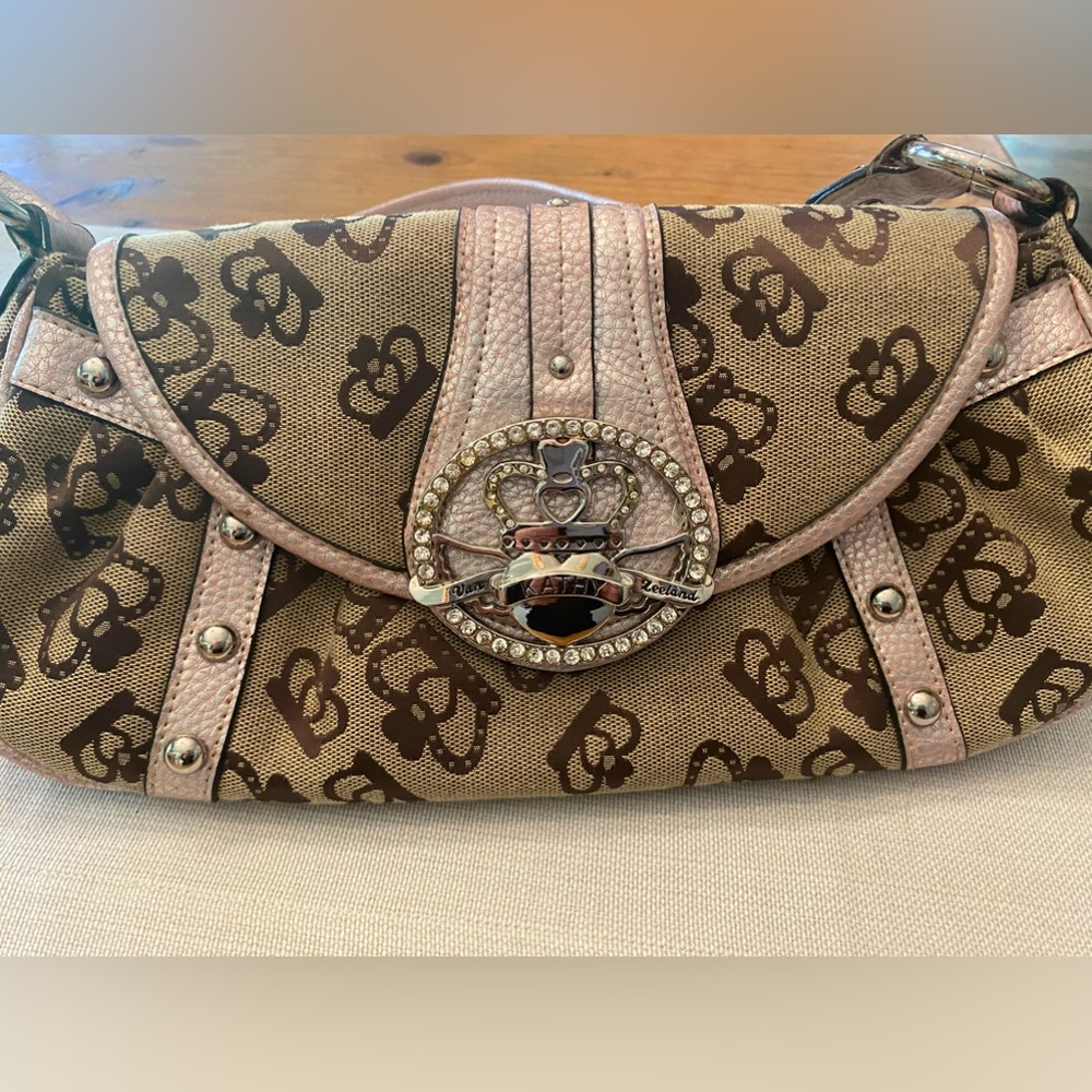 Kathy Van Zeeland Pink and Brown clutch with strap.